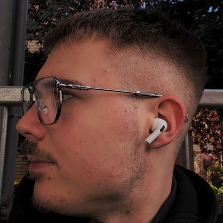 Eric Heinemann in profile, wearing glasses